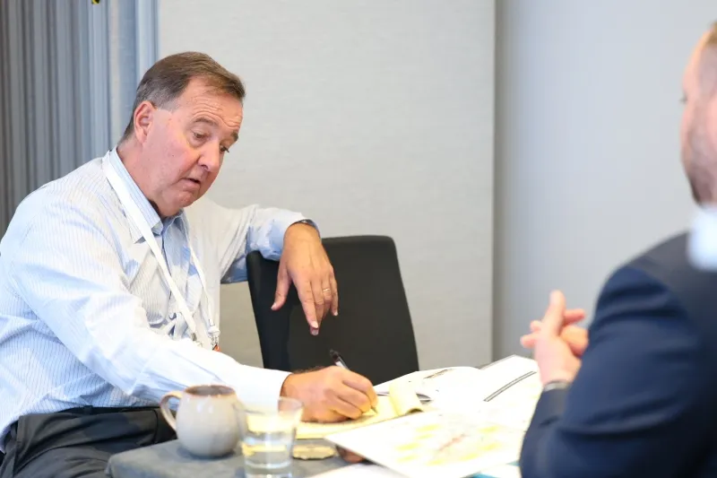 Investor discussing a mining project during a 1-2-1 meeting